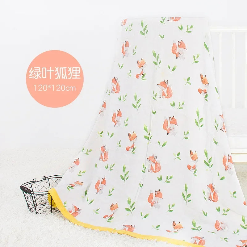 White 2-layer bamboo cotton baby blanket with orange fox and green leaf print, yellow trim, 120x120 cm, newborn swaddle.