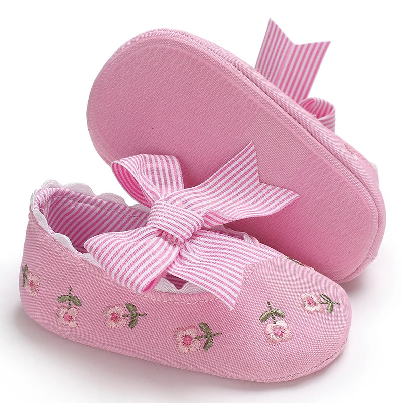 Girls' Mary Jane Soft Cloth Sole Flats Bow Detail in pink with embroidered flowers and striped bow.