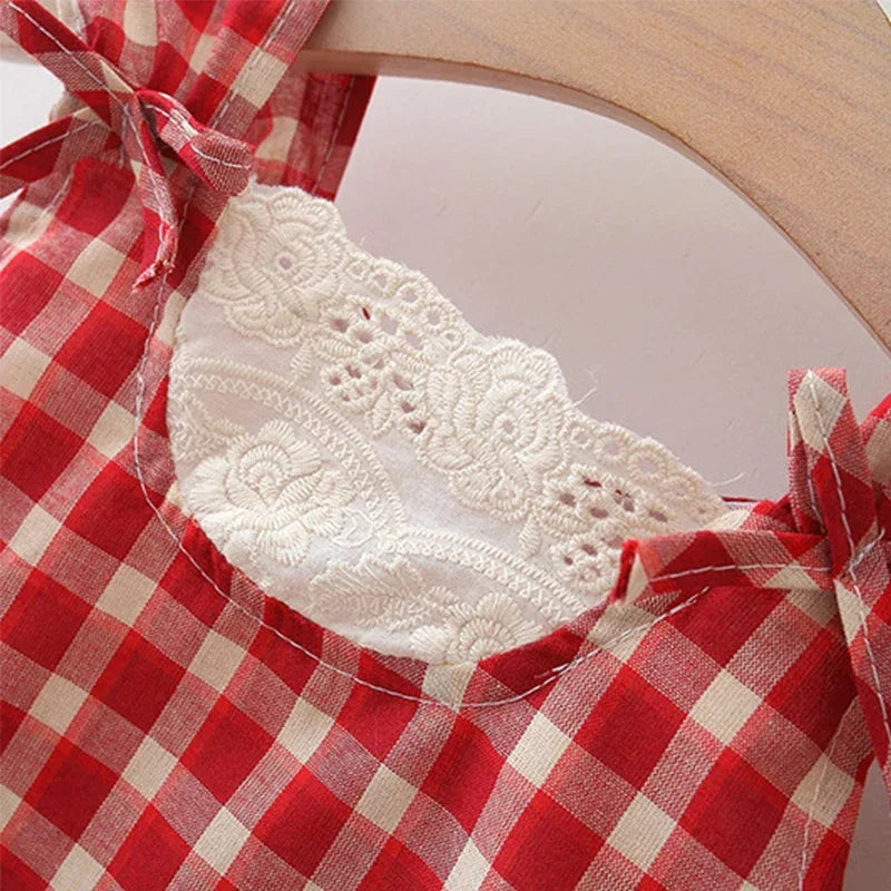 red and white checked babies party dress with white lace detail and bows on straps