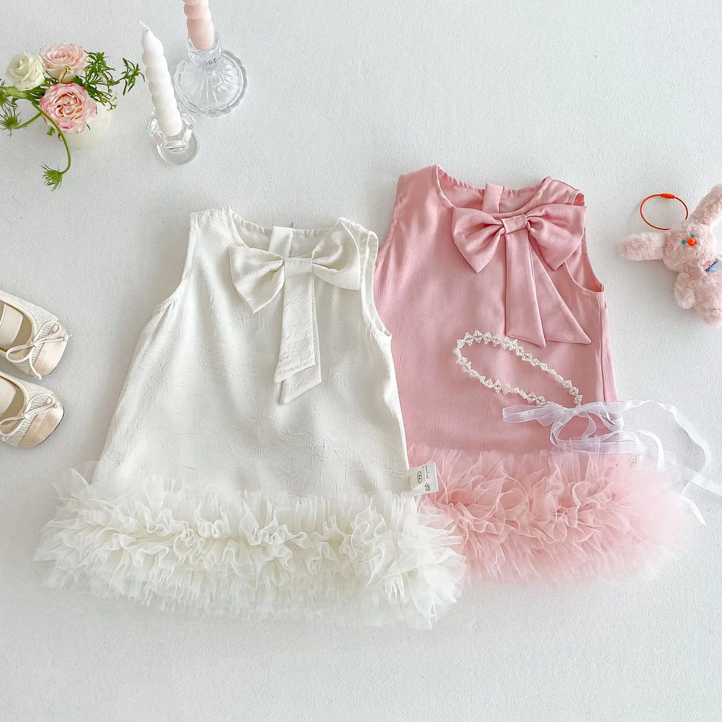 "Sabrina" Chic Children's Dress in pink and white with elegant bow accents and ruffled tulle hem, perfect for little girls.