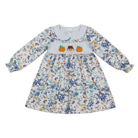 Floral long sleeve A-line dress with Peter Pan collar. Embroidered pumpkin and scarecrow detail on chest band. Festive fall outfit for toddlers.