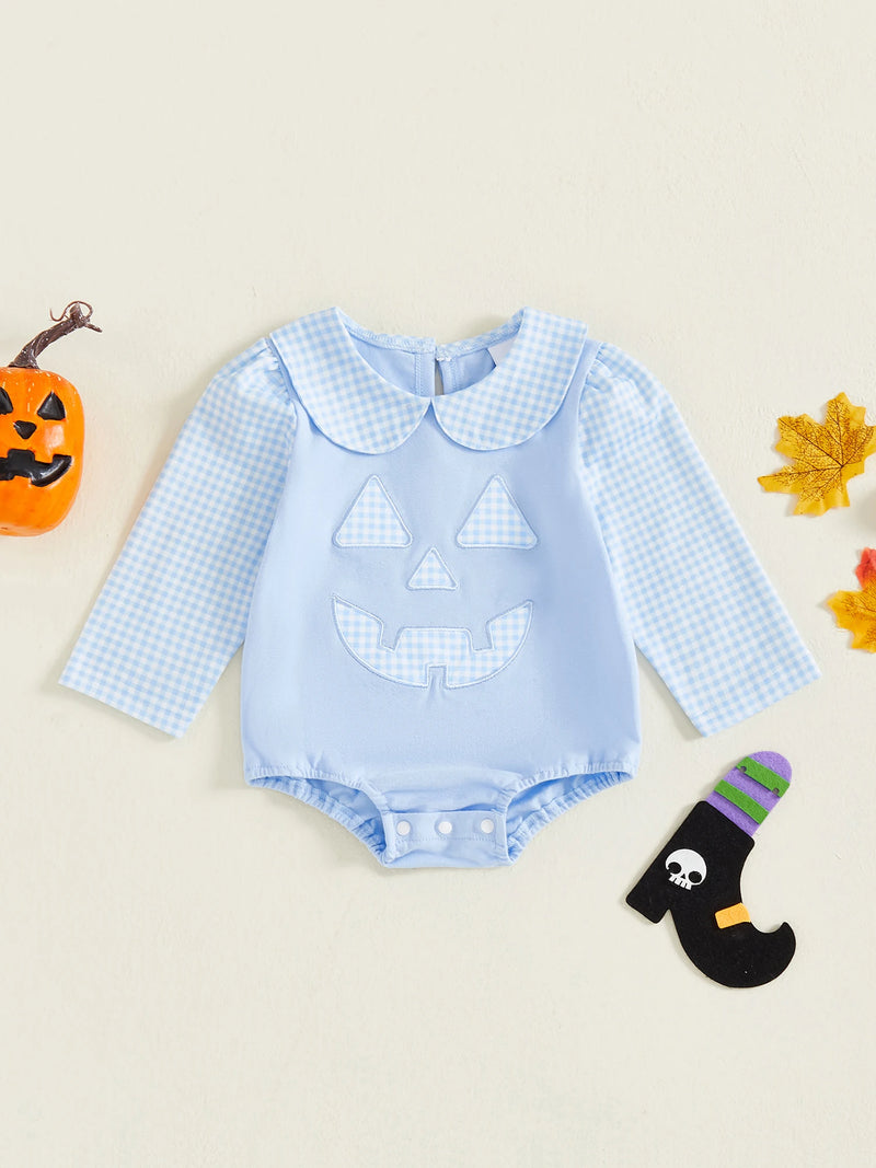 "Peter Pumpkin" Adorable Baby Blue Romper with Snaps displayed alongside Halloween decorations, showcasing its festive theme.