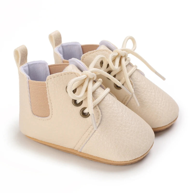 Retro-Baby Rubber Soled Lace-ups in cream color for infants, featuring a lace-up design and soft PU leather for comfort.