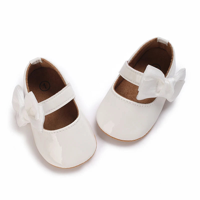 Serena Bow First Walker Shoes in white with butterfly-knot bow, perfect for infants starting to walk.