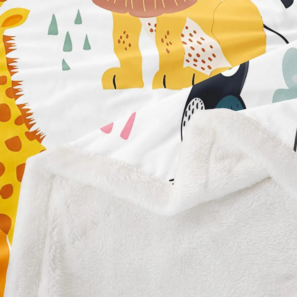 Jungle Rumble double-sided children's blanket with jungle print on one side and white plush fleece on the other.