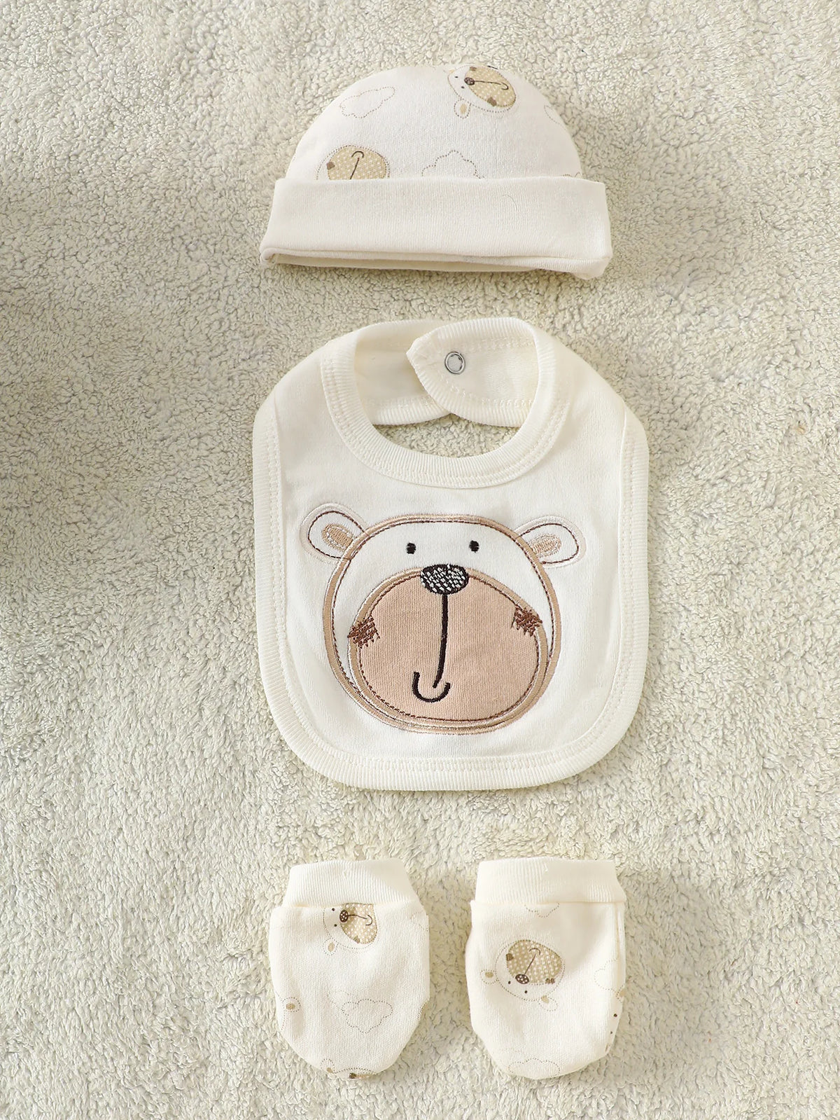 Little Bear beige 8-piece newborn romper set with bear-themed bib, hat, and socks in 100% cotton