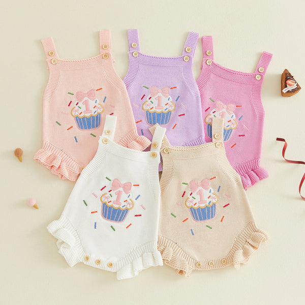 Pastel cupcake-print knit baby romper overalls with button straps and ruffled hems in pink, lavender, white, peach.