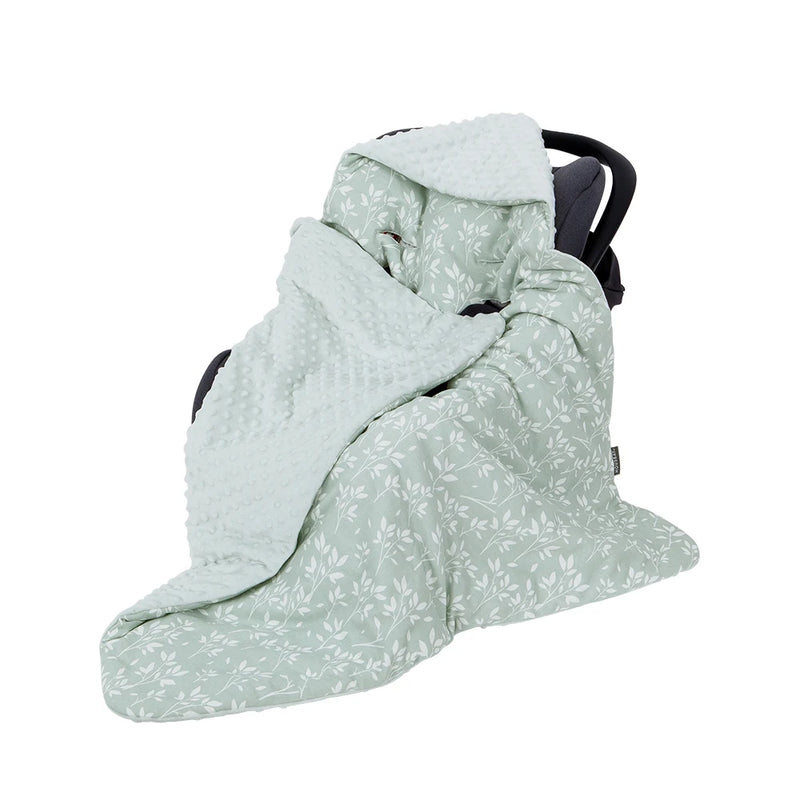 Adorable Ultra-Soft Baby Swaddle Blanket in a floral pattern, showcasing its cozy fit around a car seat, ideal for keeping babies snuggly.
