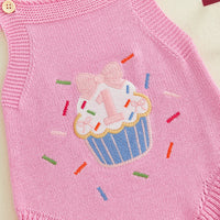 Pink knit romper overalls with cupcake applique and colorful sprinkles.