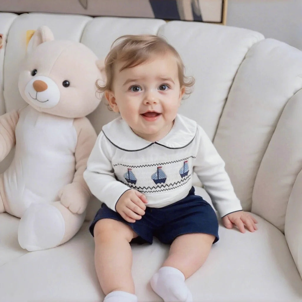 Christopher-James Adorable Nautical Toddler Outfit featuring a white smocked shirt and navy shorts.