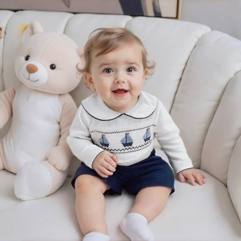 Christopher-James Adorable Nautical Toddler Outfit featuring a white smocked shirt and navy shorts.