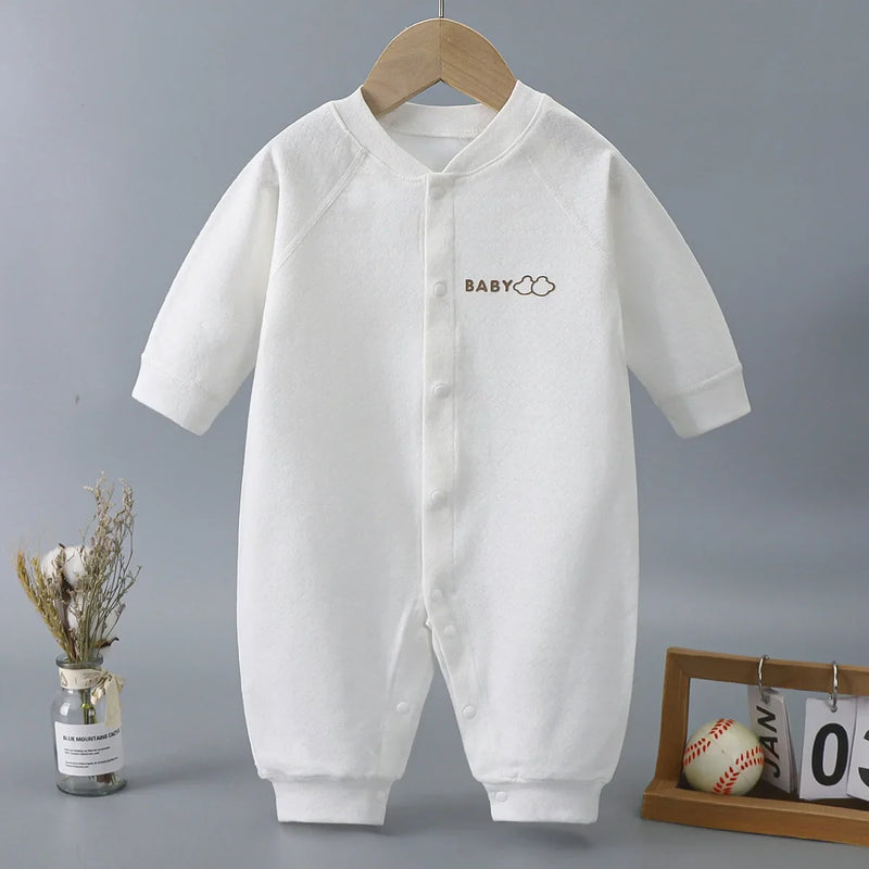 The 'Baily' White Baby's Romper made from soft cotton, perfect for babies aged 6 to 18 months. Ideal for play and everyday wear.