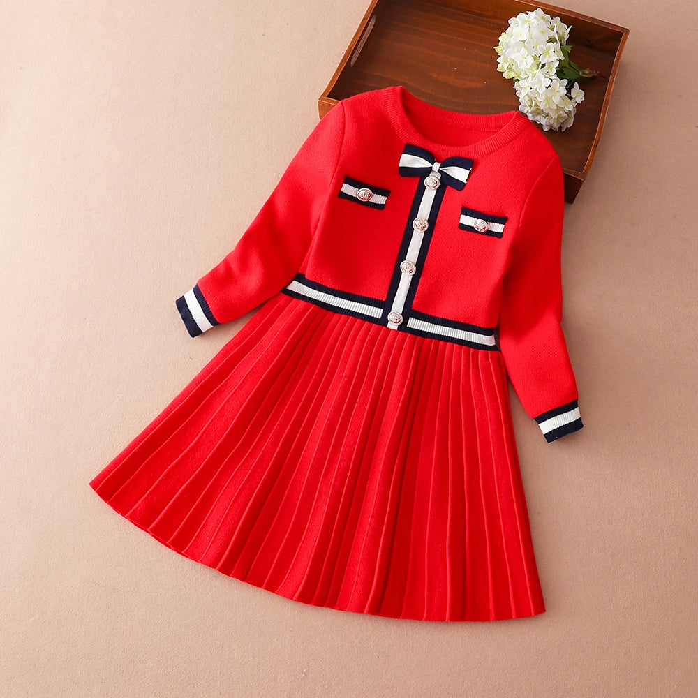 Preppy Darla Knit Dress Long Sleeves in regal red with gold button details and a pleated skirt, perfect for girls aged 5 to 12.