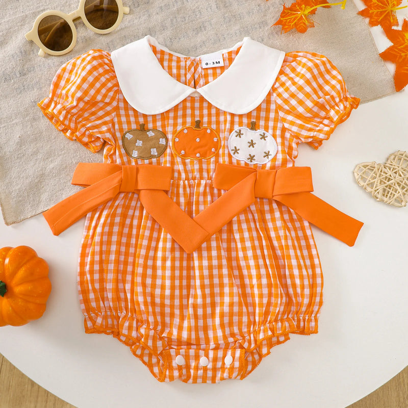 Gingham Cutie Baby Pumpkin Romper featuring cute bows and embroidered pumpkins in orange gingham pattern.
