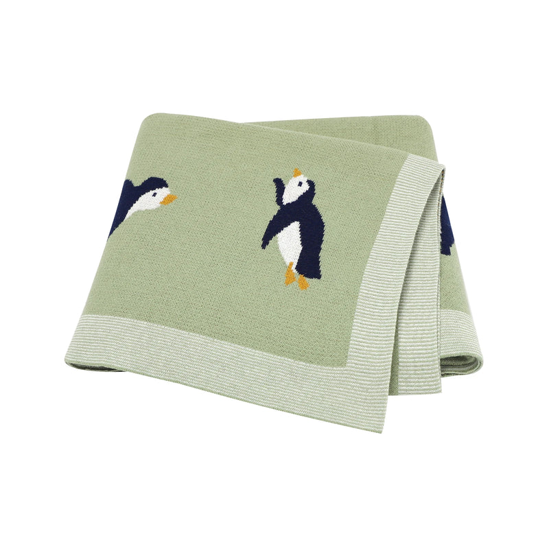 Little Penguins Children's Knit Blanket featuring a gentle color palette, perfect for creating a soothing atmosphere in a child's room.