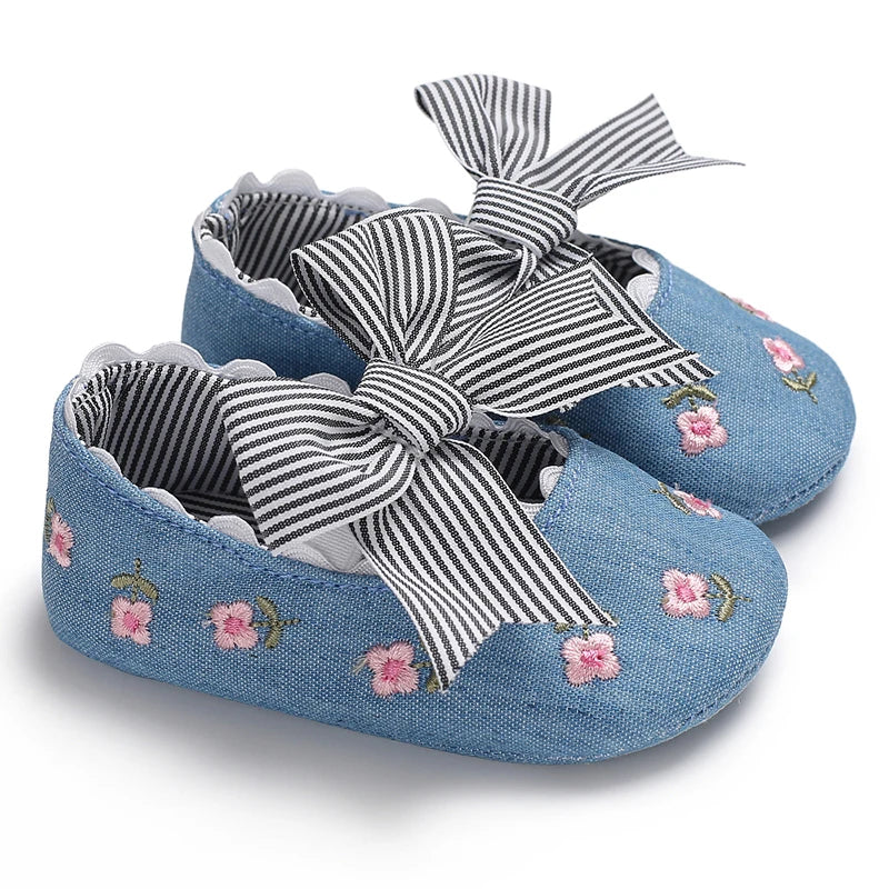 Girls' Mary Jane Soft Cloth Sole Flats Bow Detail showcasing denim design with striped bow and embroidered flowers for stylish toddlers.