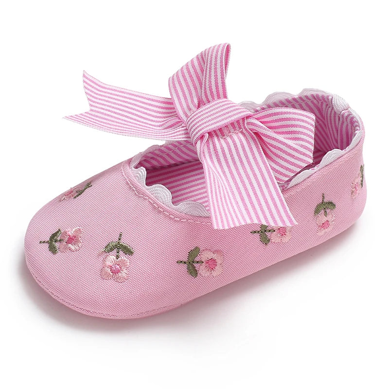 Girls' Mary Jane Soft Cloth Sole Flats Bow Detail in pink fabric adorned with floral embroidery, perfect for special occasions.