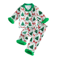Girls Christmas pajama set with tree and bow print, green collar, and fuzzy cuffs. 2-piece button-front loungewear for holiday events.