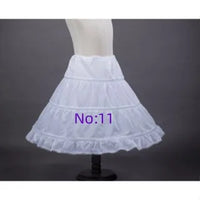 White children's petticoat crinoline underskirt with tiered ruffles, polyester, 6 styles.