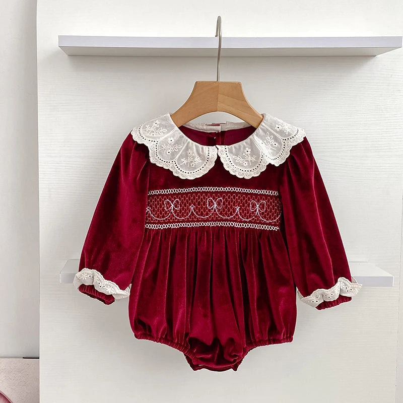 Deck the Halls Smocked Velvet and Frills Sibling Outfits - Deep Red showcasing a cozy velvet romper with a lace Peter Pan collar, designed for comfort and style.