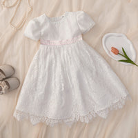 Tabitha Baptism Flower Girl Dress: white lace, pink waist sash, short sleeves, knee-length, back zipper.
