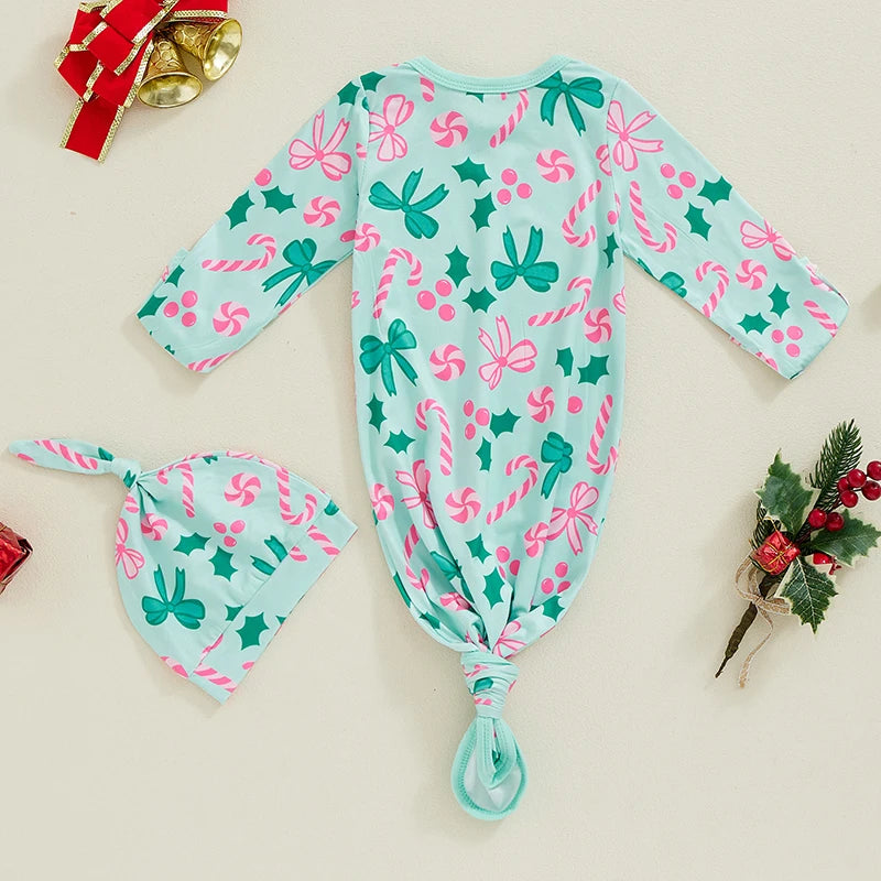 Back view of the Candy Cane Sweetie Sleeper Swaddle Gown & Hat in teal with festive patterns, highlighting the functionality and design of the baby swaddle gown.