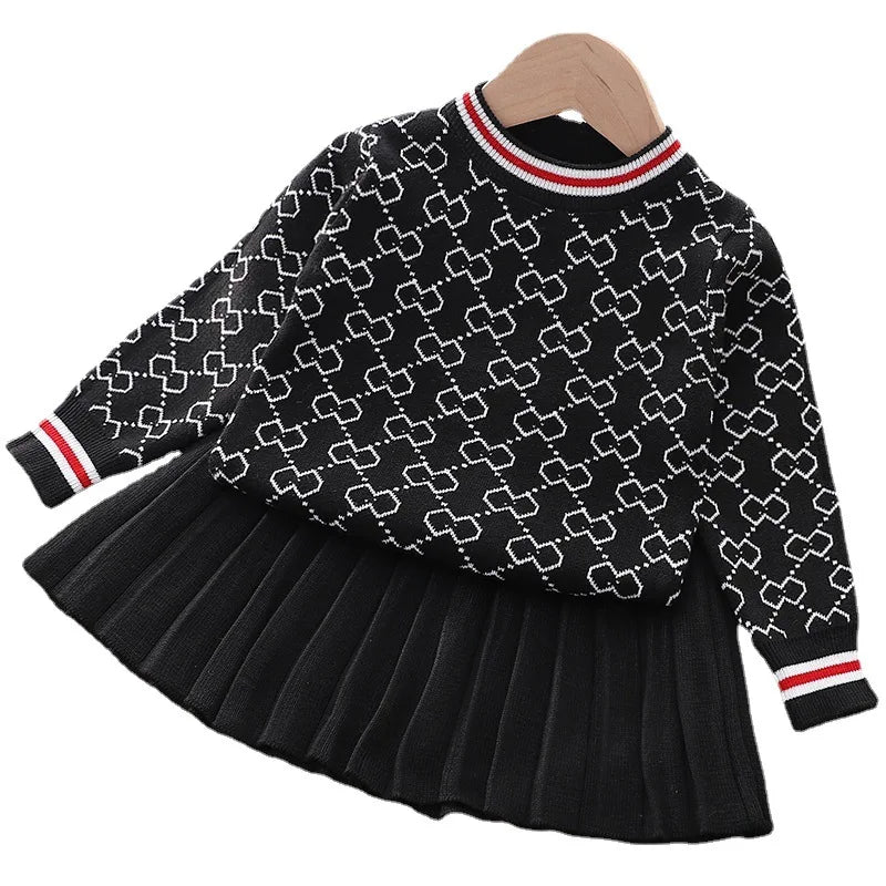 'Morgan' Classic Knit Skirt Set in black, displaying the elegant sweater design paired with a chic pleated skirt, perfect for young girls.