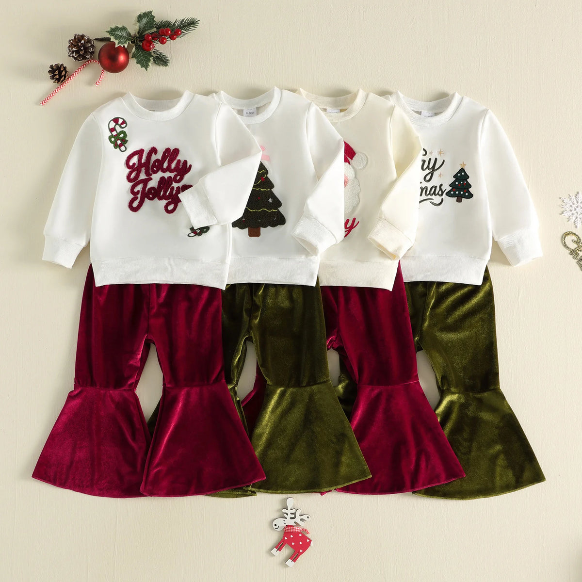 Holiday 2-piece toddler girl set with Christmas graphic pullover and cozy velvet bell bottom pants in red and green.