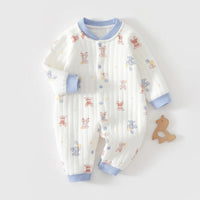 White quilted baby romper with blue cuffs, featuring cute animal prints and button closures for cozy warmth.