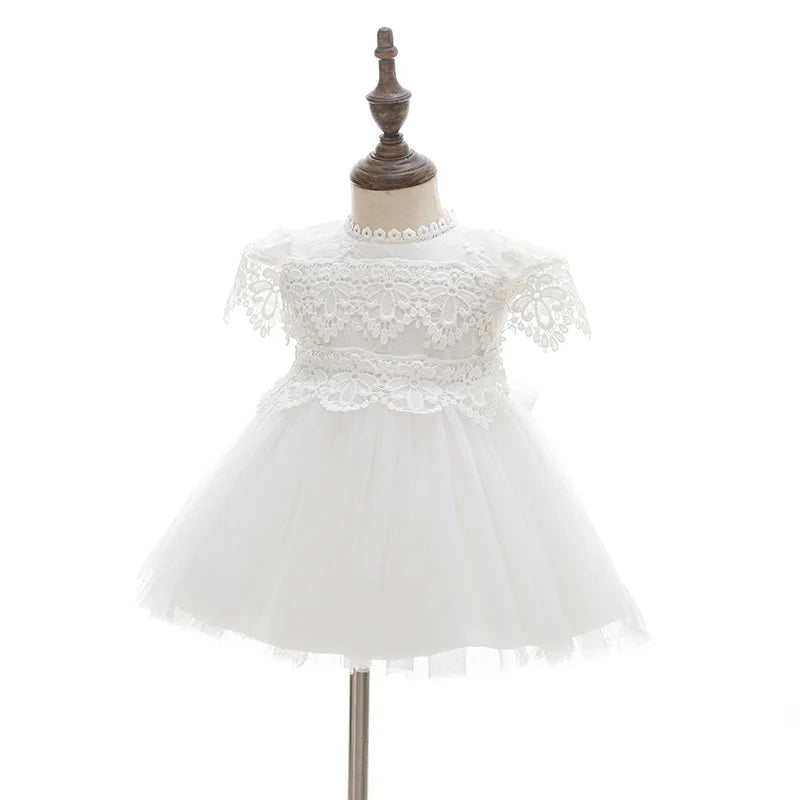 Beatrice Ann elegant lace dress for little girls, white knee-length with appliques on the lace bodice and tulle skirt.