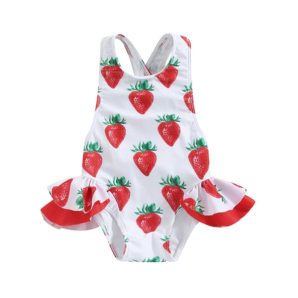 Strawberry-print toddler girl one-piece swimsuit with crisscross back and frilly red side ruffles.