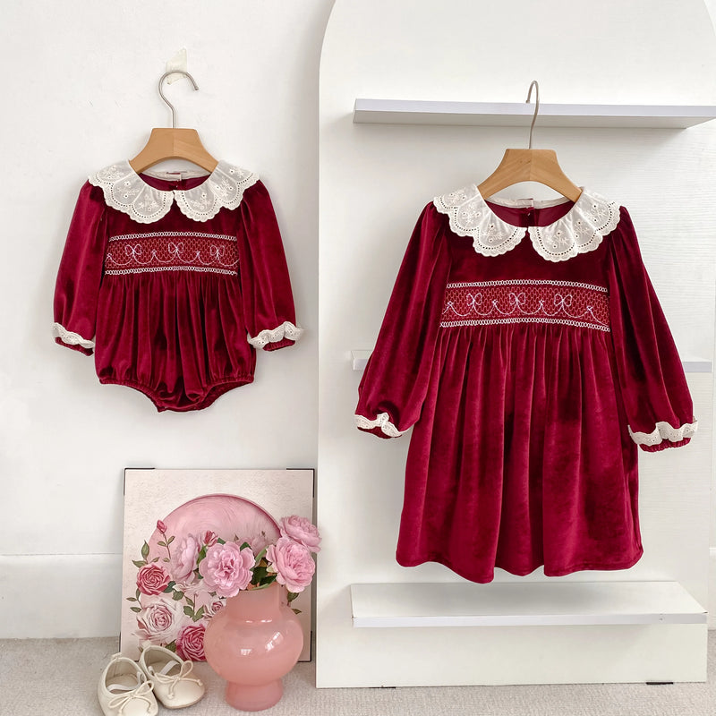 Deck the Halls Smocked Velvet and Frills Sibling Outfits in Deep Red - Coordinating romper and dress with lace collars, perfect for siblings.