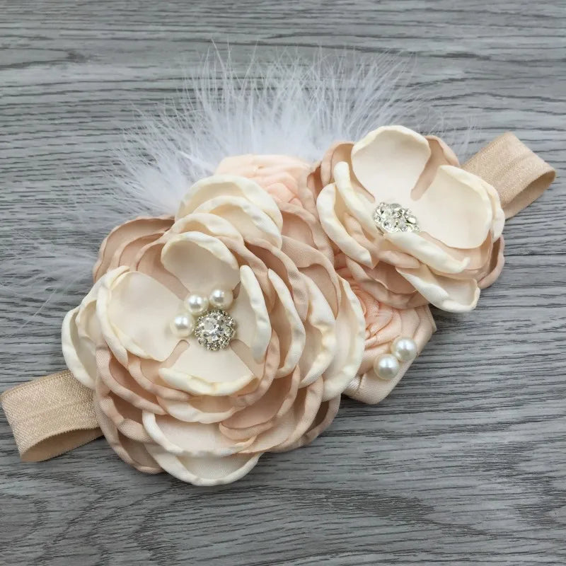Elegant Chiffon Beaded Baby Hair Accessories featuring layered fabric flowers in soft beige and white with pearls, perfect for special occasions.