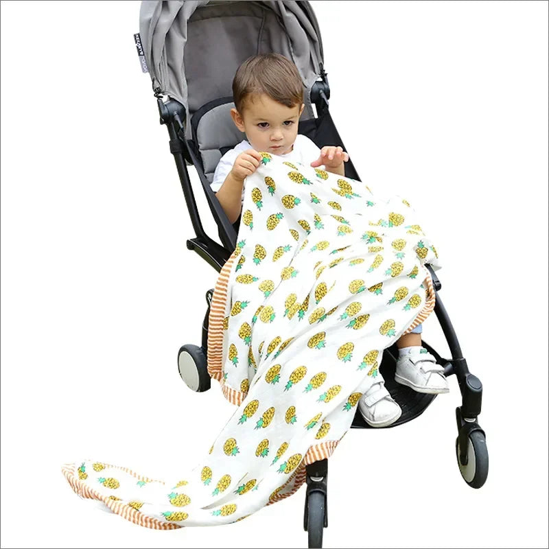 Two-layer bamboo cotton baby blanket with pineapple print, unisex newborn swaddle in stroller.