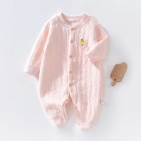 Pink quilted baby romper with long sleeves, front buttons, and cute bear patch for cozy warmth.