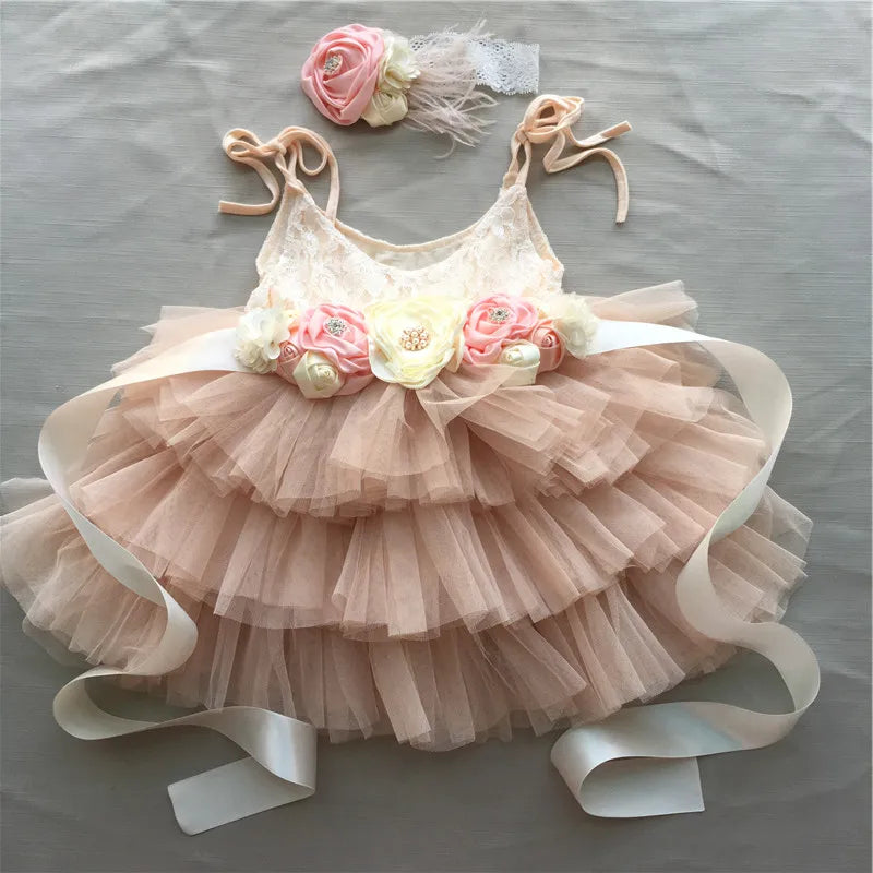 Cecilia Tiered Tulle Special Occasion Dress with lace bodice, floral belt and matching headband in peach tones.
