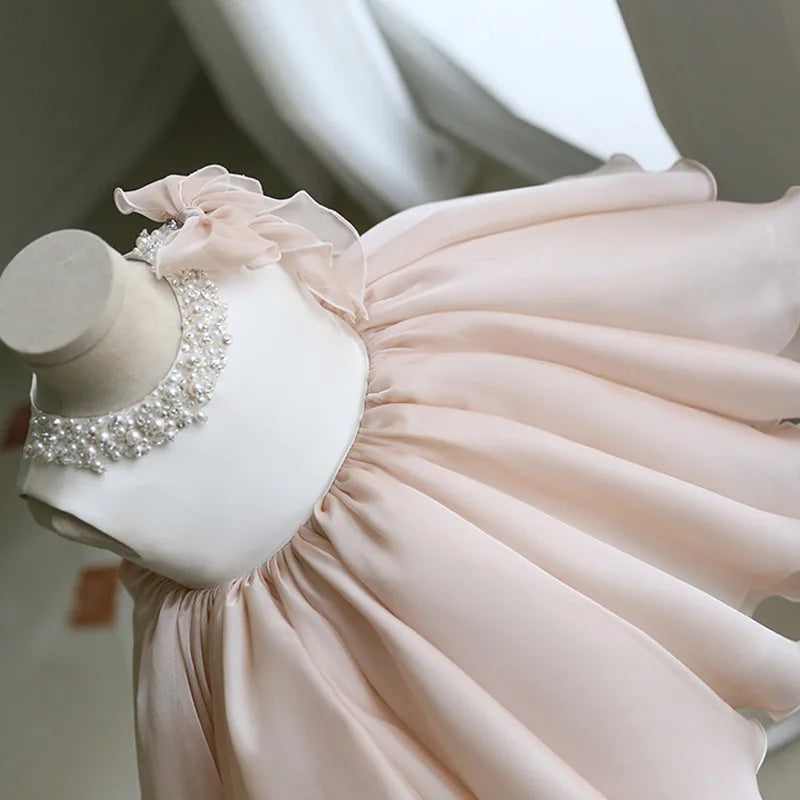 Close-up of the Gwendolyn Tulle Special Occasion Dress - Chic Beige, highlighting the fitted bodice, delicate bead embellishments, and airy layered skirt.