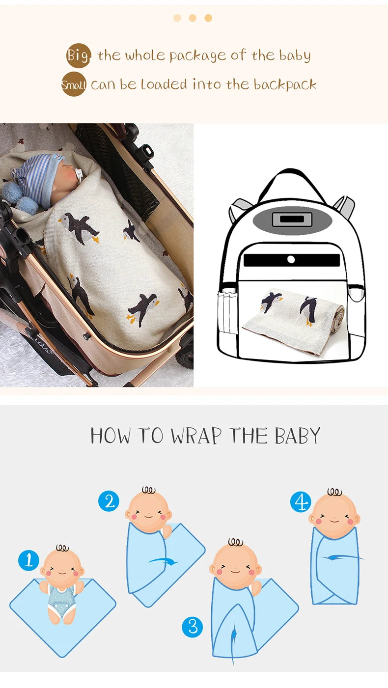 Baby wrapped in a Little Penguins Children's Knit Blanket in a stroller, exemplifying its practicality and cozy feel for on-the-go parents.