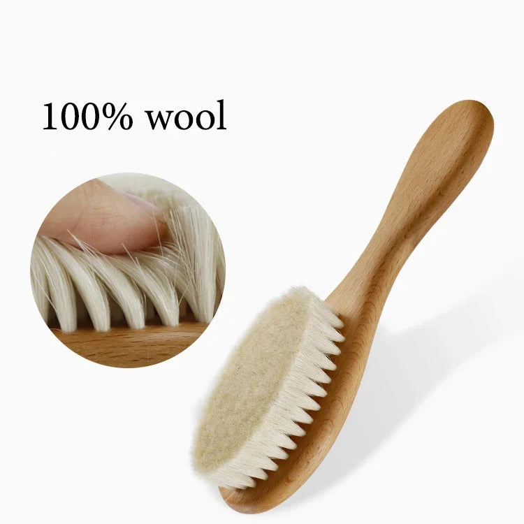 Personalized wooden baby brush with soft white bristles and curved handle, for infants and toddlers.