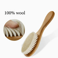 Personalized wooden baby brush with soft white bristles and curved handle, for infants and toddlers.
