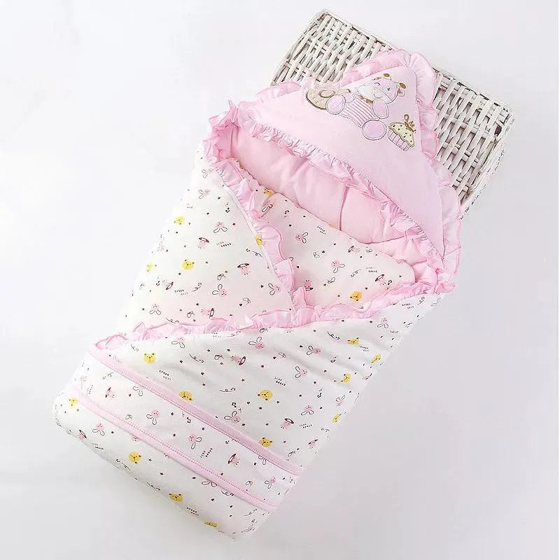 Beautiful pink 'Animal Cutie' baby swaddle wrap adorned with playful motifs, perfect for cozy snuggles and adorable photo moments.