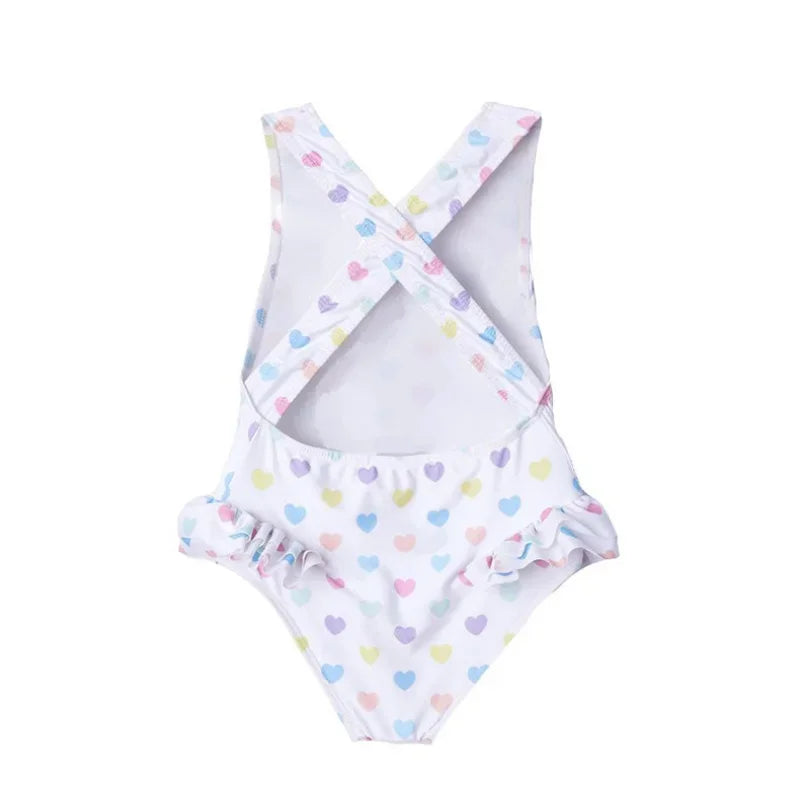 Back view of the 'Little Hearts' Ruffled One Piece Girls Summer Swimsuit, showcasing crisscross straps, suitable for ages 1-6.