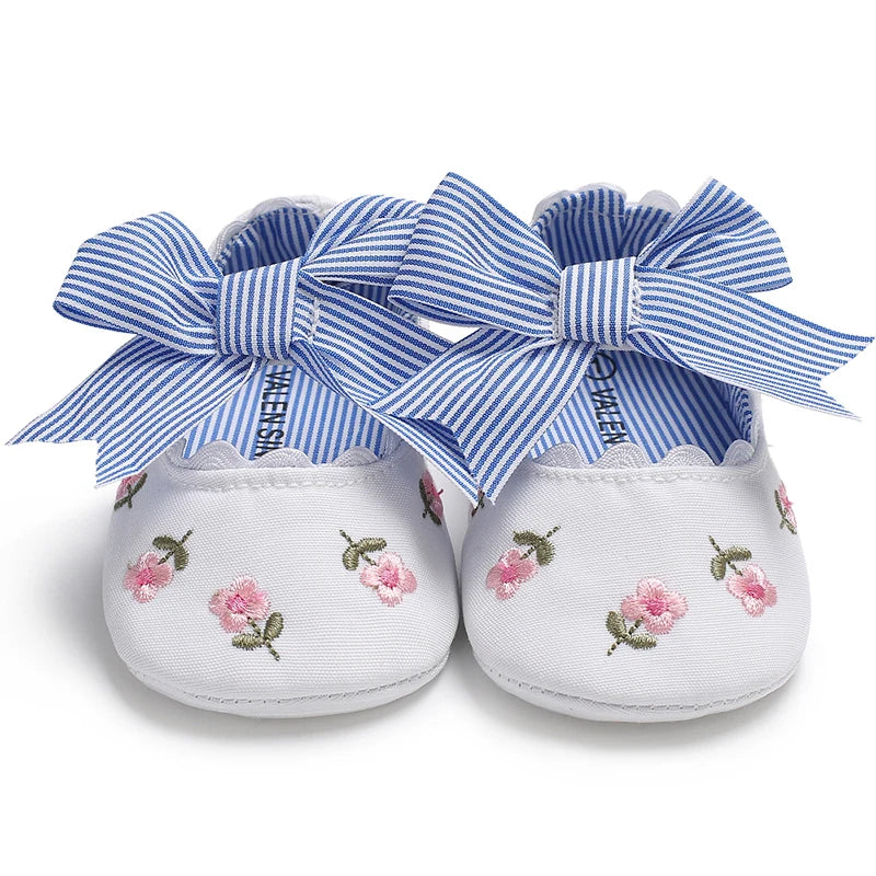 Girls' Mary Jane Soft Cloth Sole Flats Bow Detail in white featuring a pair of bows and floral embroidery.