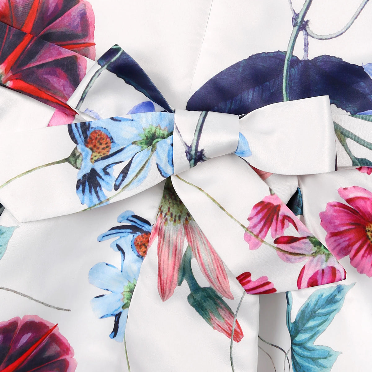 Little Girls Tropical Garden Party Dress in 6 vivacious colors with floral print and bow detail.