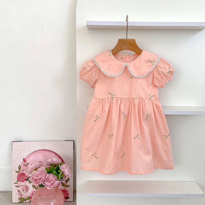 'Sweet Lydia' Little Girl's Dress in princess pink with delicate lace accents and embroidered details, designed for stylish comfort for girls aged 2 to 6.