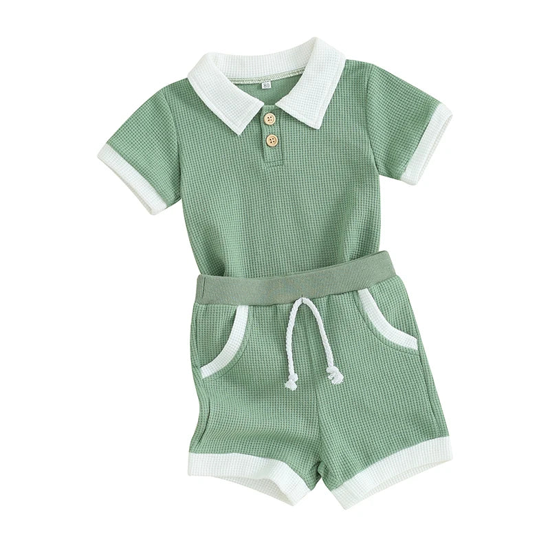 Ocean Breezes boys green waffle knit polo shorts set with white trim collar, cuffs, pockets and drawstring waist