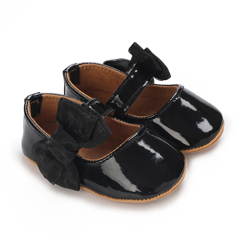 Serena Bow First Walker Shoes - Chic black Toddler shoes with a sweet bow, designed for fashionable infants.