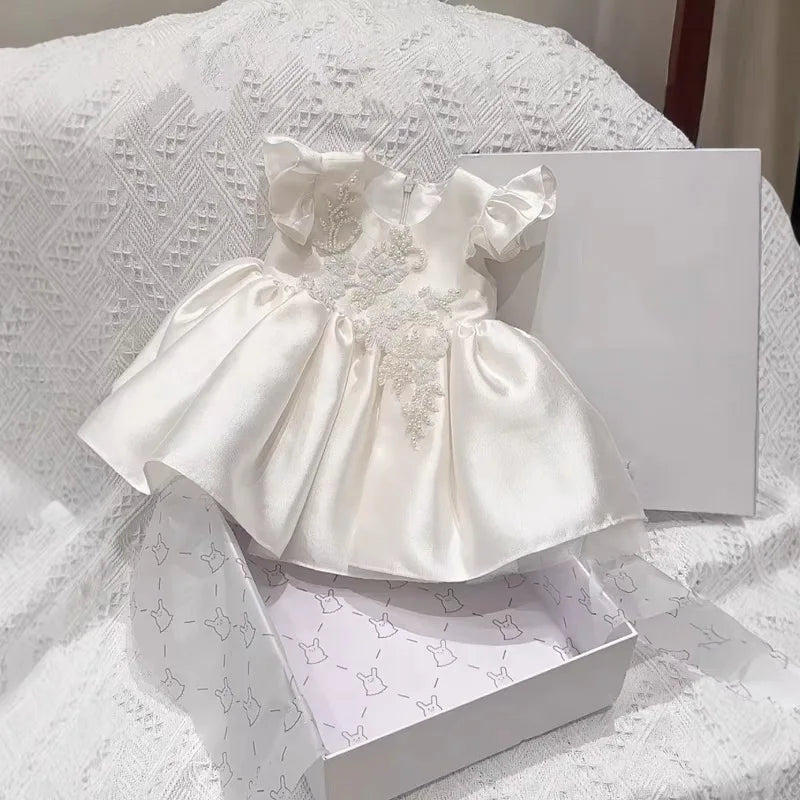 Astrid satin flutter-sleeve princess dress, white with roundneck beaded bodice, zip back, ruched skirt.