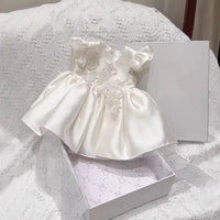 Astrid satin flutter-sleeve princess dress, white with roundneck beaded bodice, zip back, ruched skirt.