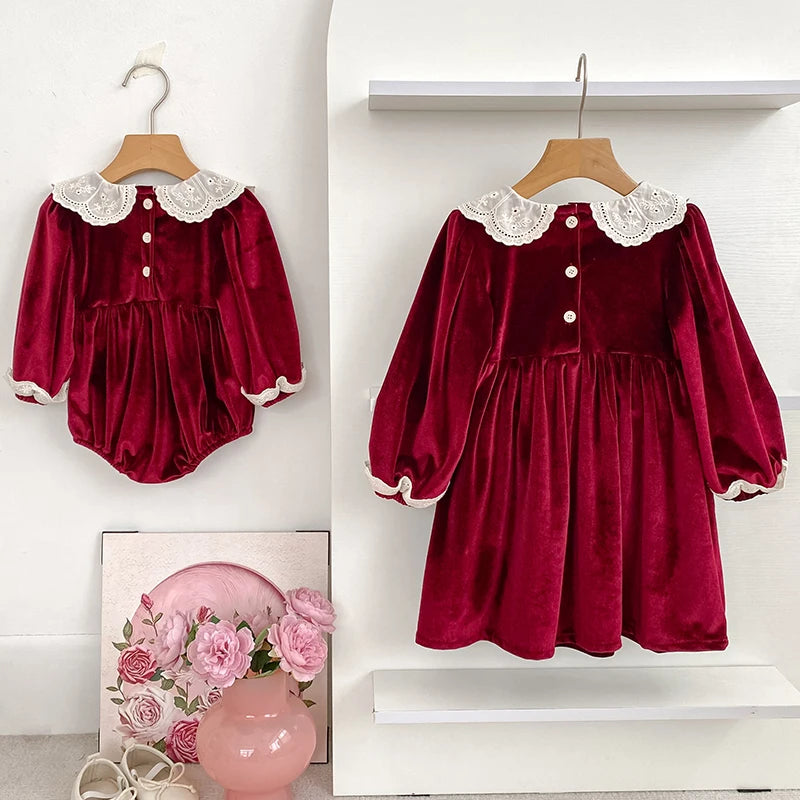 Deck the Halls Smocked Velvet and Frills Sibling Outfits in Deep Red - Close-up of toddler romper and dress featuring buttons and smocking.